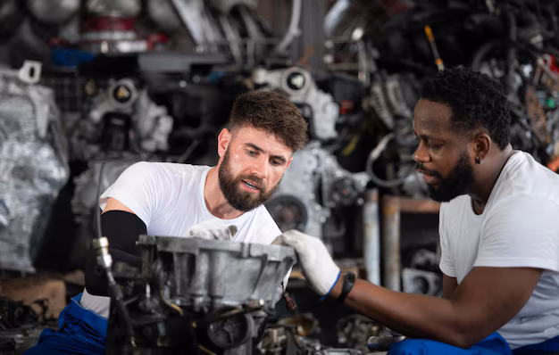 two-men-repairing-car-engine-auto-repair-shop